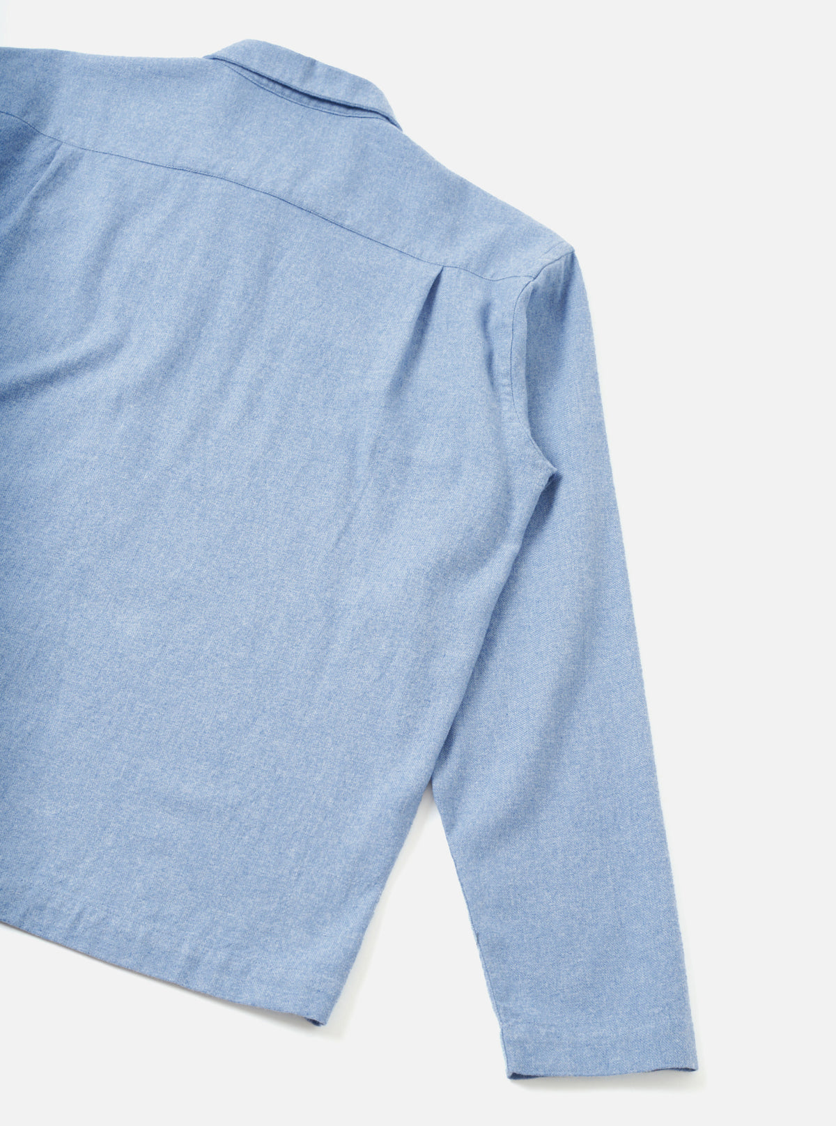 A full back view of the Sky Blue Monty Cotton Tencel Zip Shirt displayed on a clean white studio background, showing the clean shoulders, back panel seams, and relaxed fit design.
