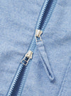 A close-up detail shot of the Sky Blue Monty Cotton Tencel Zip Shirt set against a plain white background, highlighting the front zipper hardware, collar structure, and fabric texture.