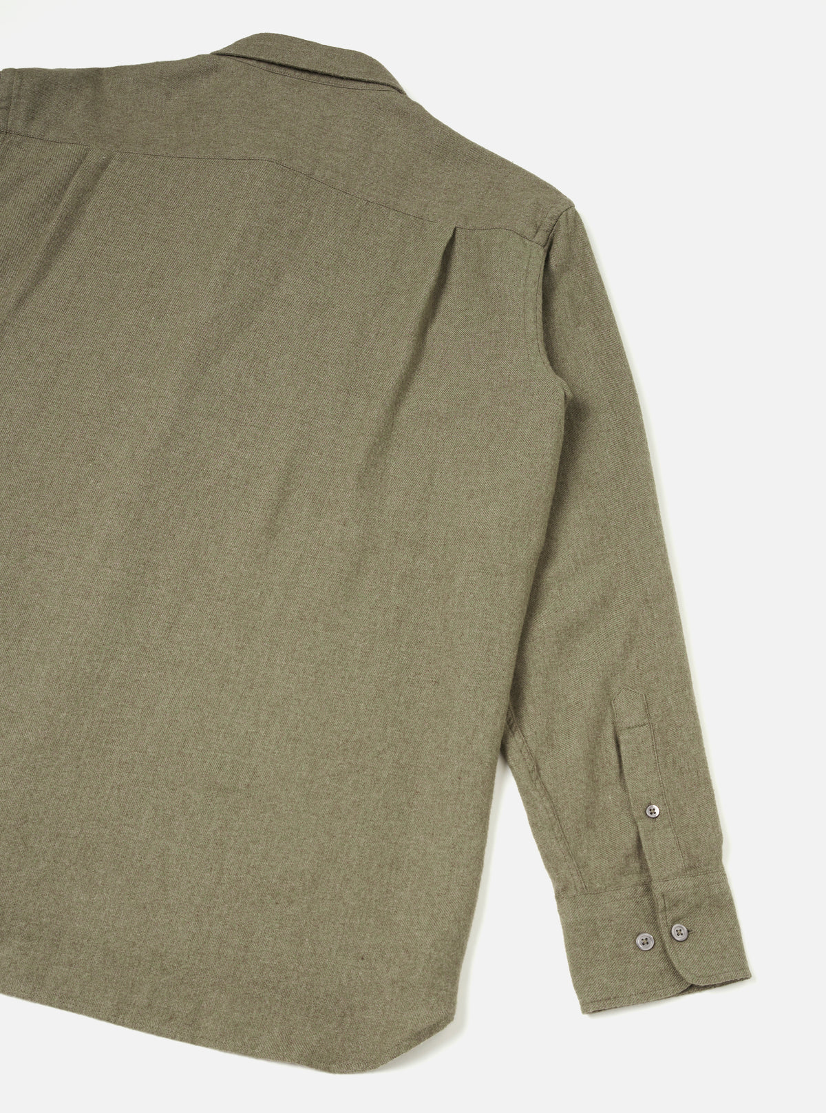 A back view of the Olive Monty Cotton Tencel Standard Shirt set against a clean white studio background, displaying the rear shoulder yoke, subtle pleat detail, and straight hem finish.