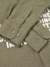 A detailed close-up shot of the collar and button placket on the Olive Monty Cotton Tencel Standard Shirt, set against a plain studio background to show fine stitching and buttons.