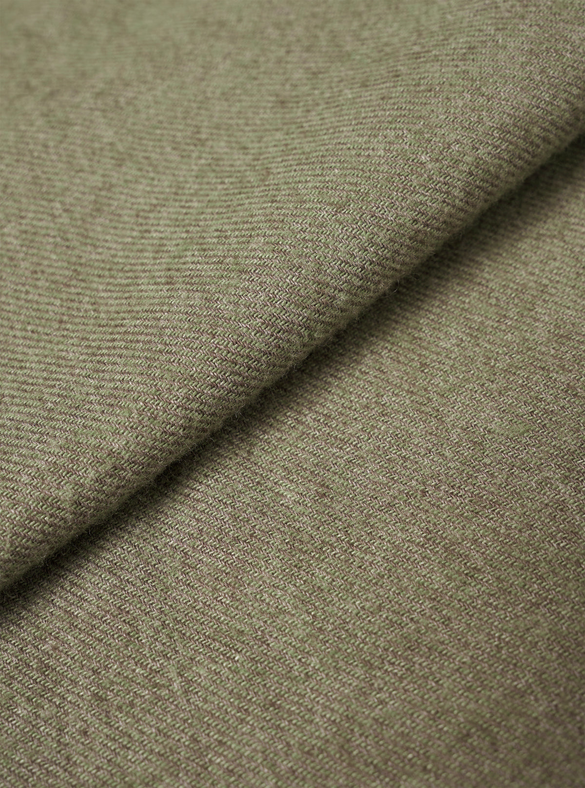 A detailed fabric swatch image filling the entire frame to demonstrate the woven texture and muted olive green hue of the fabric used for the Olive Monty Cotton Tencel Standard Shirt.