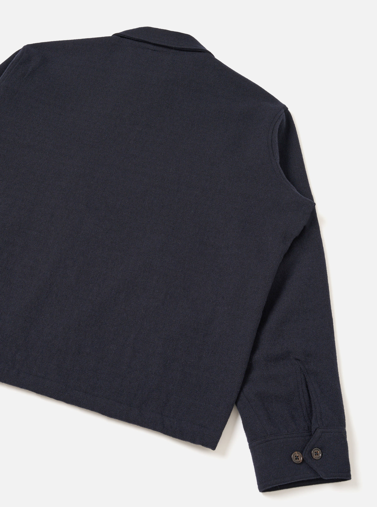 A back view of the Dark Navy Robin Wool Mix Club Jacket set against a plain off-white studio background, showcasing the clean rear yoke, straight hemline, and premium dark navy wool-blend texture.