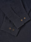 A male model wears the Dark Navy Robin Wool Mix Club Jacket unzipped in a three-quarter pose against a light studio background, highlighting the front pockets and comfortable layering potential.