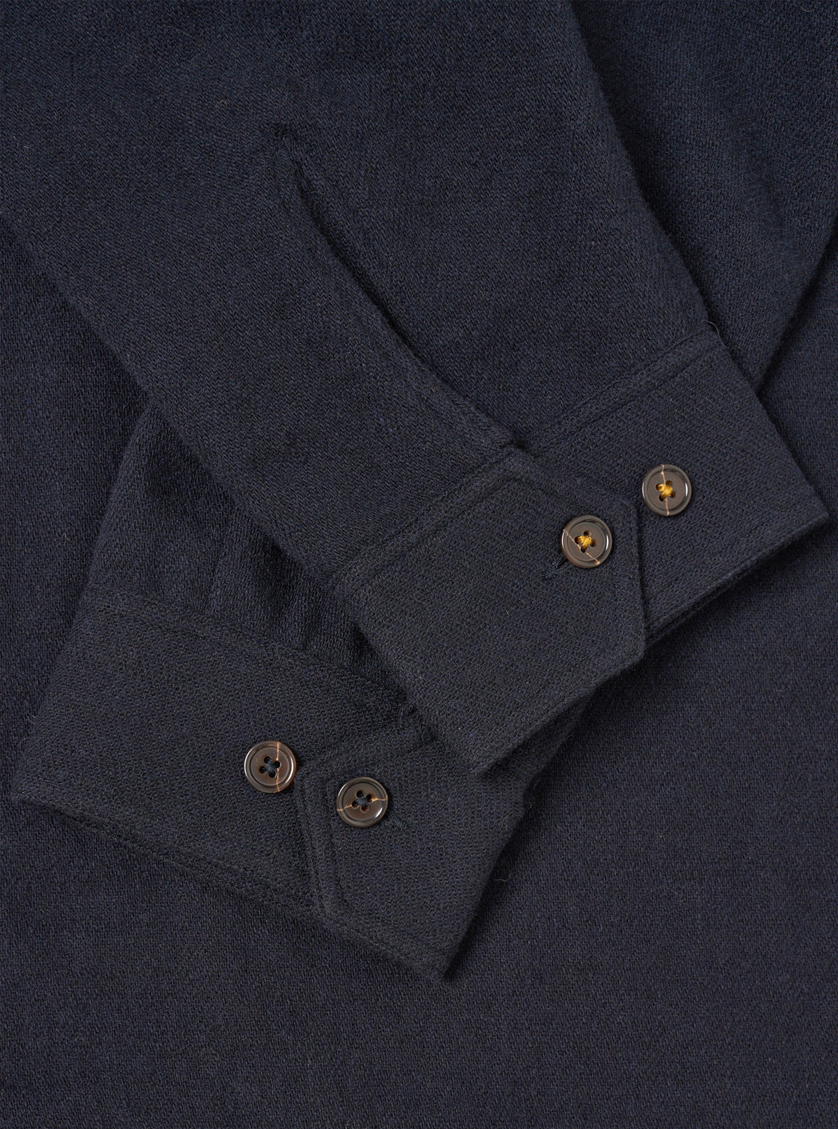 A male model wears the Dark Navy Robin Wool Mix Club Jacket unzipped in a three-quarter pose against a light studio background, highlighting the front pockets and comfortable layering potential.