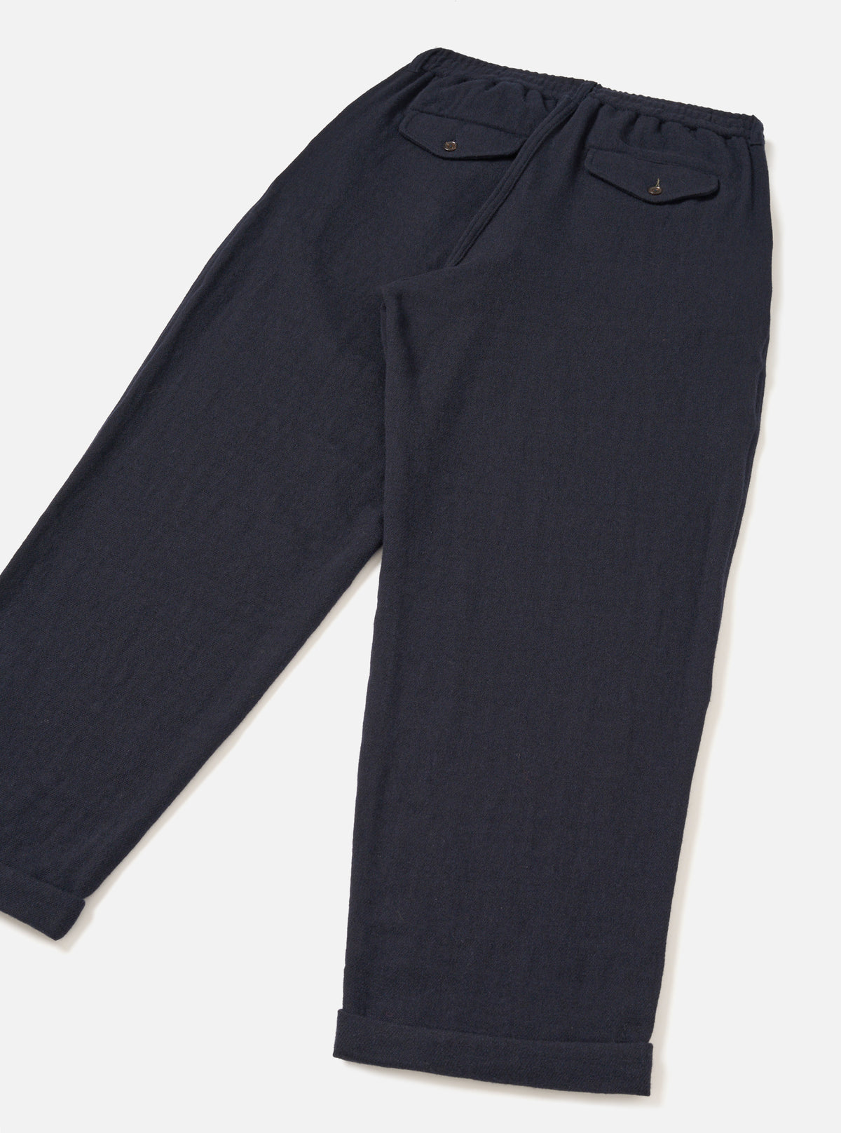 Back view of the Dark Navy Robin Wool Mix Lindberg Pant presented against a clean light background, showing the rear flap jetted pockets, relaxed seat, and neat turn-up hem details.