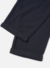 A male model wears the Dark Navy Robin Wool Mix Lindberg Pant in an angled pose against a white studio background, illustrating how the trousers drape and fit around the waist and legs.