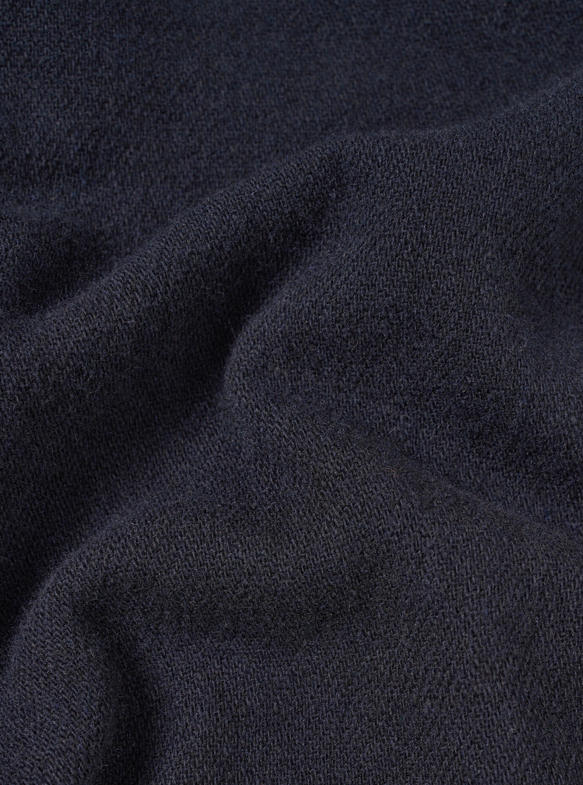 A fabric swatch close-up image showing the texture and deep color of the Dark Navy Robin Wool Mix Lindberg Pant material, filling the frame to feature the high-quality wool blend.