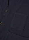 A male model wears the Dark Navy Robin Wool Mix JJ Waistcoat buttoned up over a shirt, standing against a neutral studio backdrop to show the relaxed tailoring and comfortable fit.