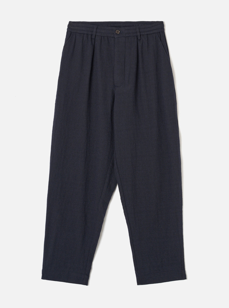 Front view of the Dark Navy Robin Wool Mix Pleated Track Pant presented on a white background, displaying the elasticated drawstring waist, single front pleat, and tapered leg design.