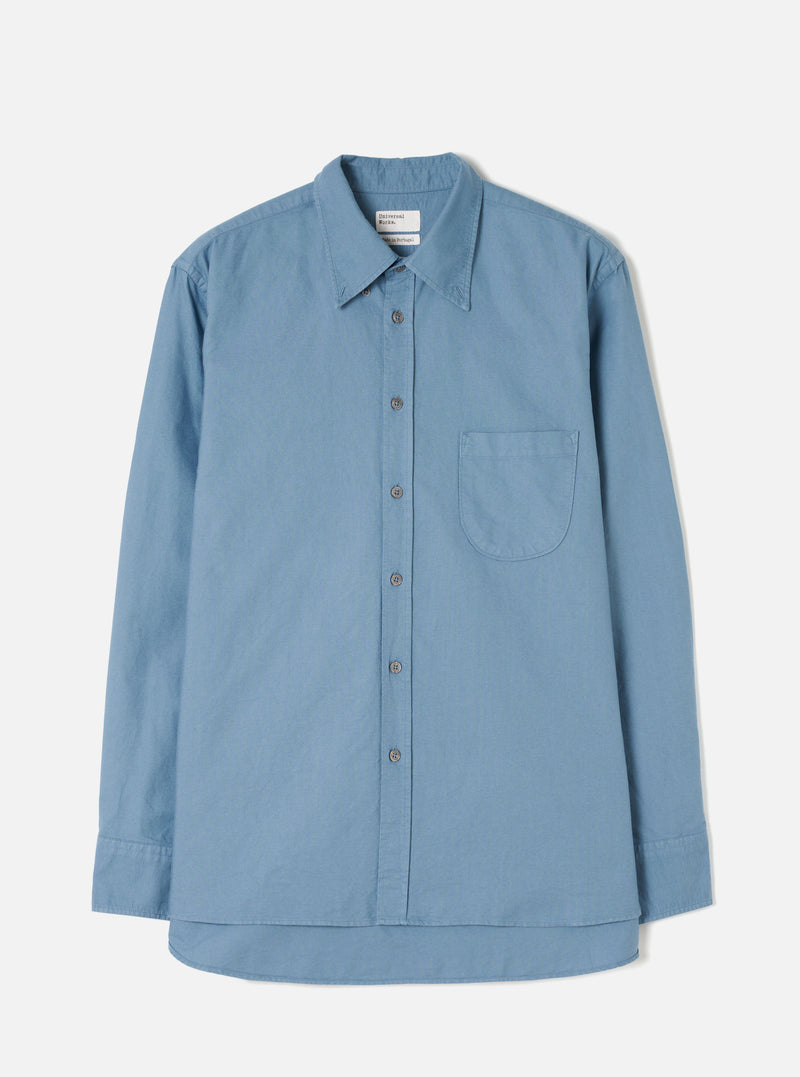 Front view of the Mid Blue R.Oxford Lazy Day Shirt displayed flat against a clean off-white background, highlighting the button-down collar, asymmetric chest pocket, and full button placket.