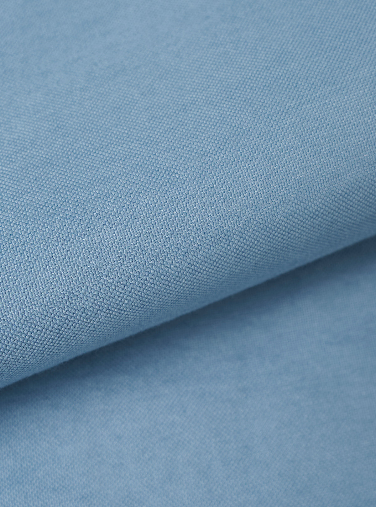 A close-up fabric swatch view showing the rich woven Oxford cotton texture of the Mid Blue R.Oxford Lazy Day Shirt, filling the frame to showcase the mid-blue color and fabric construction.