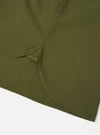 A detailed close-up shot of the Olive R.Oxford Lazy Day Shirt, showing the asymmetric chest pocket, neat stitching, and button-down collar against a plain studio background.
