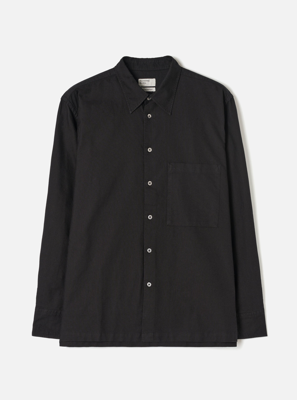 Front view of the Black R.Oxford Lucky Shirt displayed against a clean off-white background, featuring a two-piece collar, large square chest pocket, full button front, and straight hem.