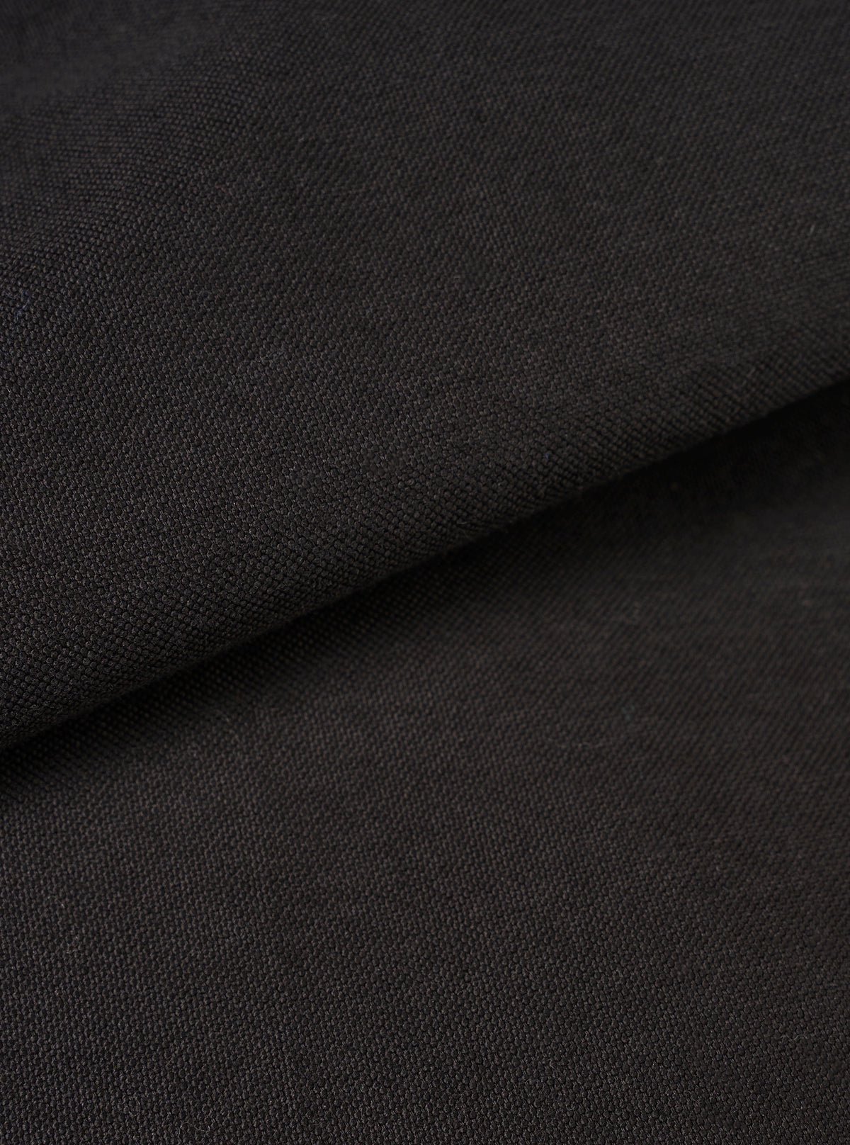A close-up fabric swatch image showcasing the tight weave and subtle texture of the Black R.Oxford Lucky Shirt, filling the frame to display the deep black cotton fabric quality.