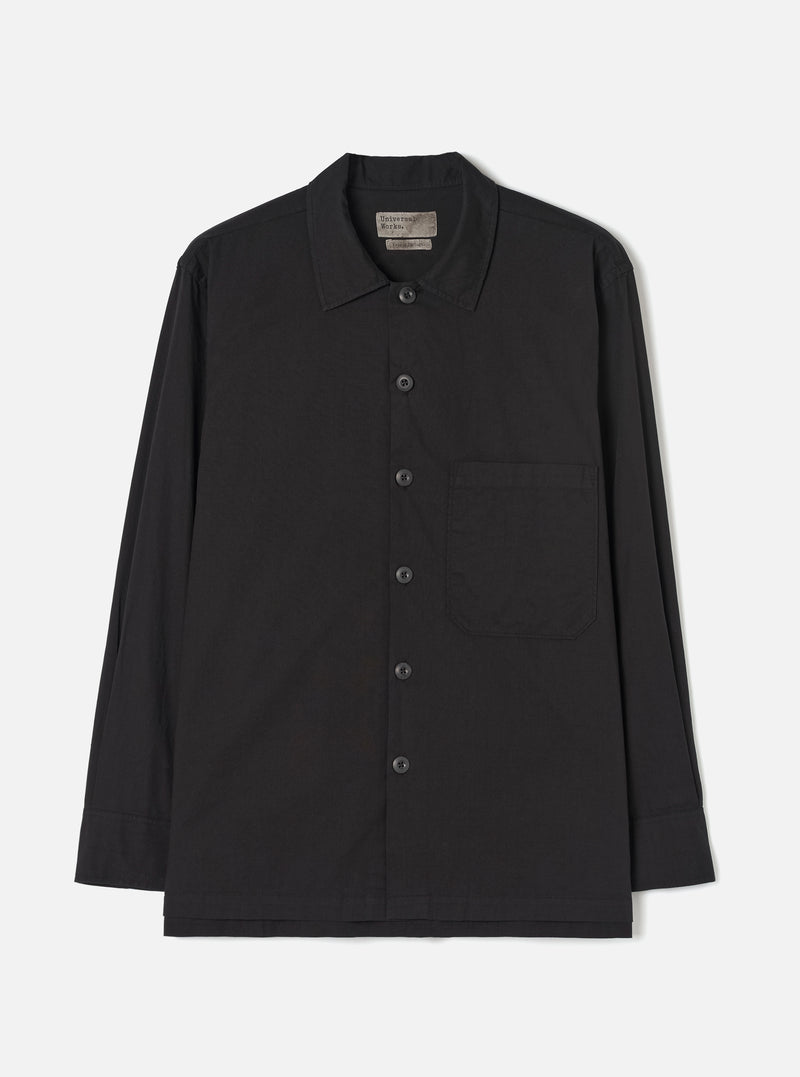 Front view of the Black Slub Shirting Fatigue Shirt shown against a plain white background. The image showcases the front chest pockets, button closures, neat collar, and relaxed fit of the black slub cotton fabric garment.