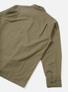 Back view of the Olive Slub Shirting Fatigue Shirt set against a plain white studio background. The image highlights the clean rear panel, hem finishing, and relaxed cut made from olive slub cotton fabric.