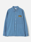 Front view of the Washed Indigo Recycled Herringbone Patch Lucky Shirt displayed on a clean white background. The shot highlights the classic button-down collar, front button placket, and patch pocket details.