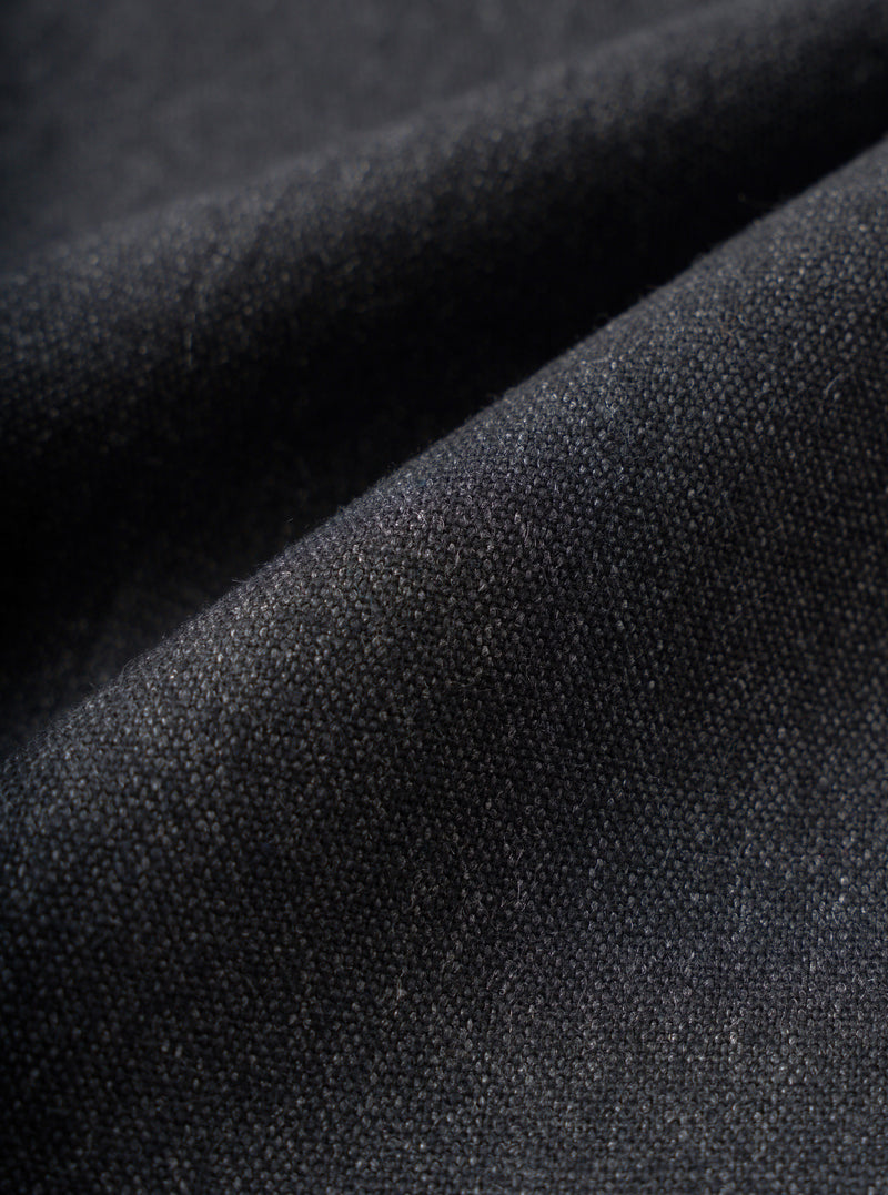 A close-up fabric swatch image displaying the detailed texture of the Charcoal Recycled Italian Tweed Military Chino on a plain white background, highlighting the dark grey recycled wool blend weave.