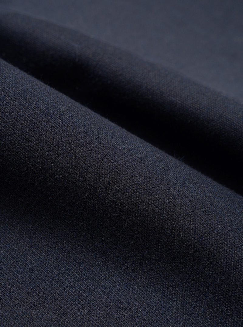 A close-up fabric swatch image showing the intricate texture of the Navy Recycled Italian Tweed Military Chino against a plain white background, highlighting the rich navy blue recycled wool blend yarns.