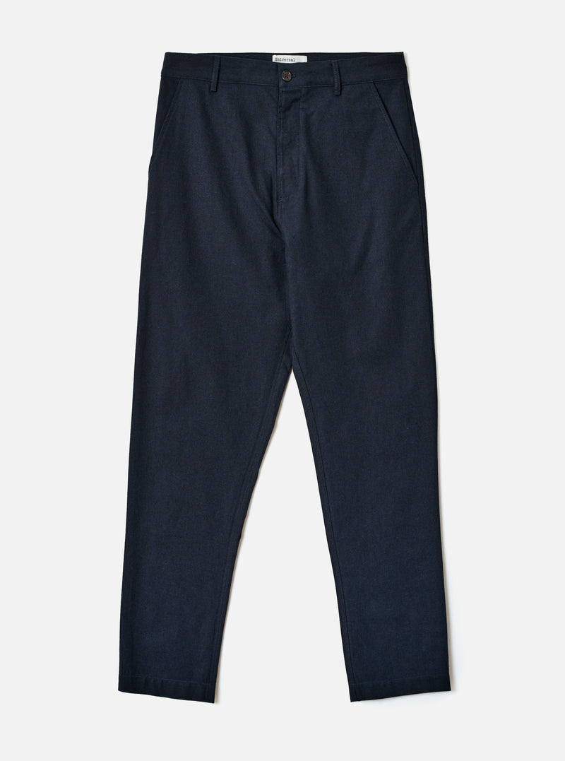 A full-length front view of a model wearing the Navy Lucca Suiting Military Chino against a neutral studio backdrop, demonstrating the slim straight fit, front slant pockets, and tailored look of the navy trousers.