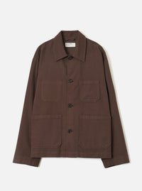 A front view of a model wearing the Brown Comfort Moleskin Ives Jacket against a neutral studio background, illustrating the casual chore jacket cut, front button placket, and rich brown moleskin texture.