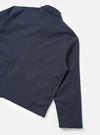 Rear view of the Navy Comfort Moleskin Ives Jacket displayed against a plain white background. The shot highlights the clean back panel, hemline, and soft brushed cotton moleskin texture of the dark blue chore jacket.