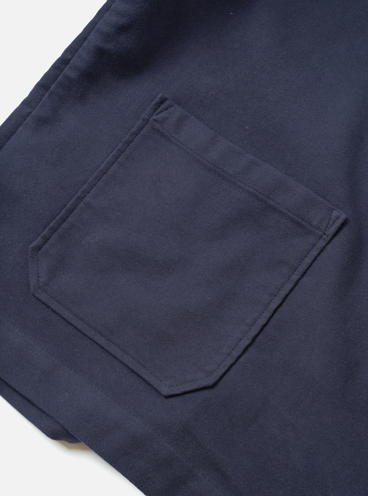 A close-up view of the Navy Comfort Moleskin Ives Jacket on a plain white background, showing the internal chest pocket, collar stitching, and rich texture of the deep navy blue brushed cotton moleskin fabric.