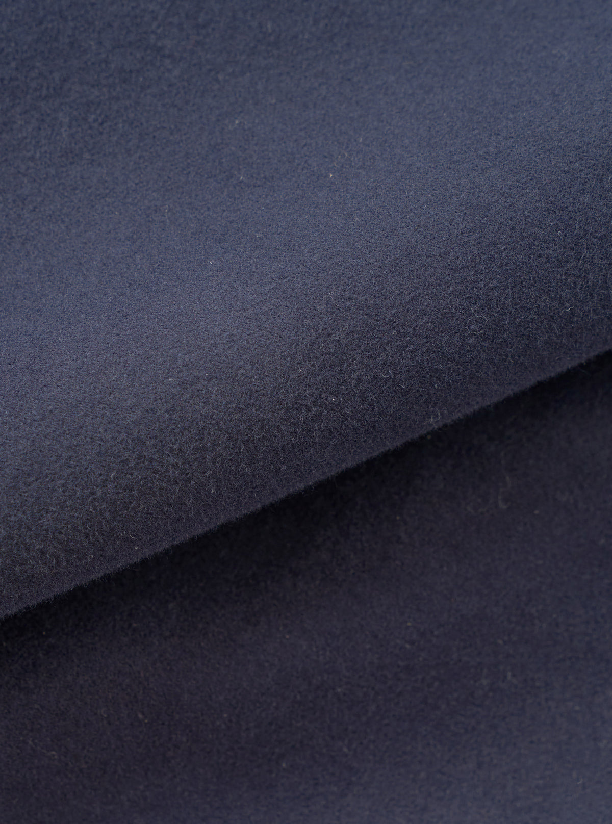 A close-up fabric swatch image showcasing the dark blue texture of the Navy Comfort Moleskin Ives Jacket against a white background, highlighting the soft brushed surface of the pure cotton moleskin weave.