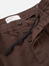 A detailed shot of the Brown Comfort Moleskin Pleated Track Pant on a plain white background, focusing on the drawstring waistband, front pleat detail, and soft texture of the brown brushed cotton moleskin.