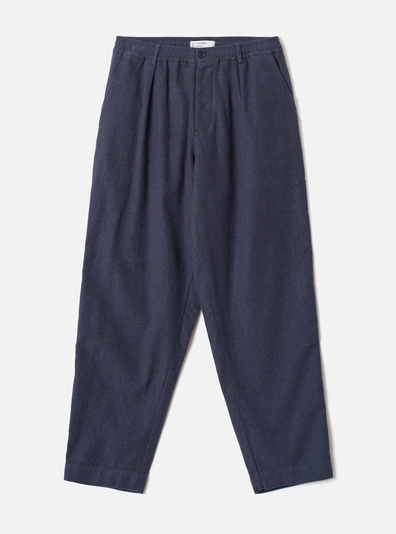 A full front view of the Navy Comfort Moleskin Pleated Track Pant presented on a plain white studio background, displaying the single pleat front, drawstring elastic waistband, and loose tapered trouser shape.