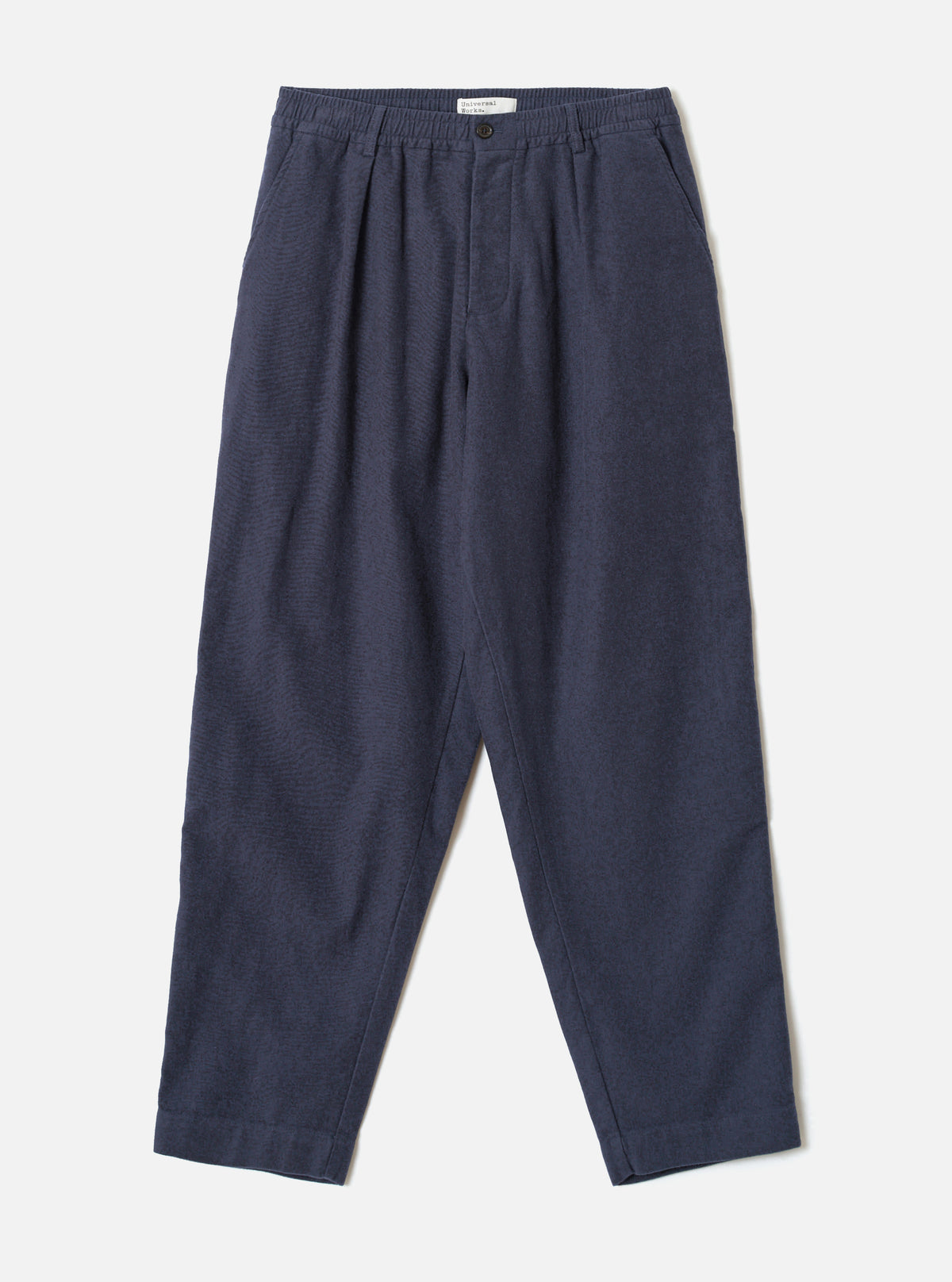 A full front view of the Navy Comfort Moleskin Pleated Track Pant presented on a plain white studio background, displaying the single pleat front, drawstring elastic waistband, and loose tapered trouser shape.