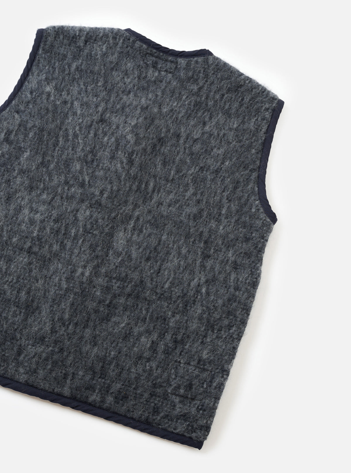 A back view of a model wearing the Navy/Pale Grey Losso Mohair Mix Lancaster Gilet against a neutral backdrop, highlighting the clean rear cut, soft mohair blend fabric, and classic sleeveless silhouette.