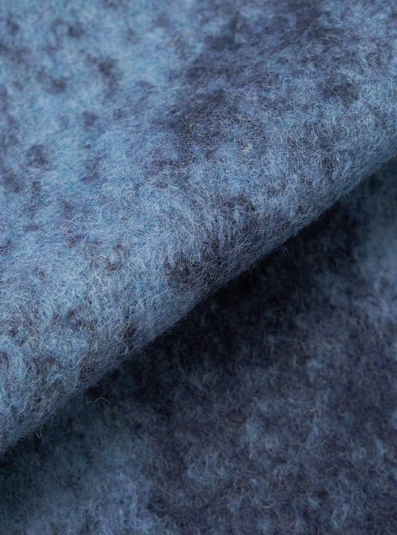 A close-up fabric swatch image showing the detailed blue cloud camouflage knit pattern of the Blue Cloud Camo Knit Cardigan against a white background, highlighting the soft texture of the wool yarn.
