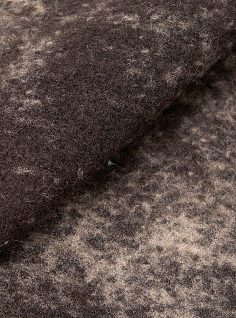 A close-up fabric swatch image of the Brown Cloud Camo Knit Cardigan on a white background, highlighting the detailed brown cloud camouflage pattern and soft woven texture of the pure wool yarn.