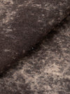 A close-up fabric swatch image of the Brown Cloud Camo Knit Cardigan on a white background, highlighting the detailed brown cloud camouflage pattern and soft woven texture of the pure wool yarn.