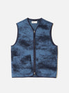 A full-length front view of a model wearing the Blue Cloud Camo Knit Zip Gilet in a studio shot, highlighting its full-zip front, sleeveless silhouette, collarless neck, and blue cloud camo pattern.