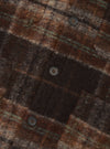 Close-up detail shot of the Brown Pino Wool Fleece Cardigan set against a plain background, focusing on the button front closure, textured wool-blend fleece fabric, and neat front stitching.