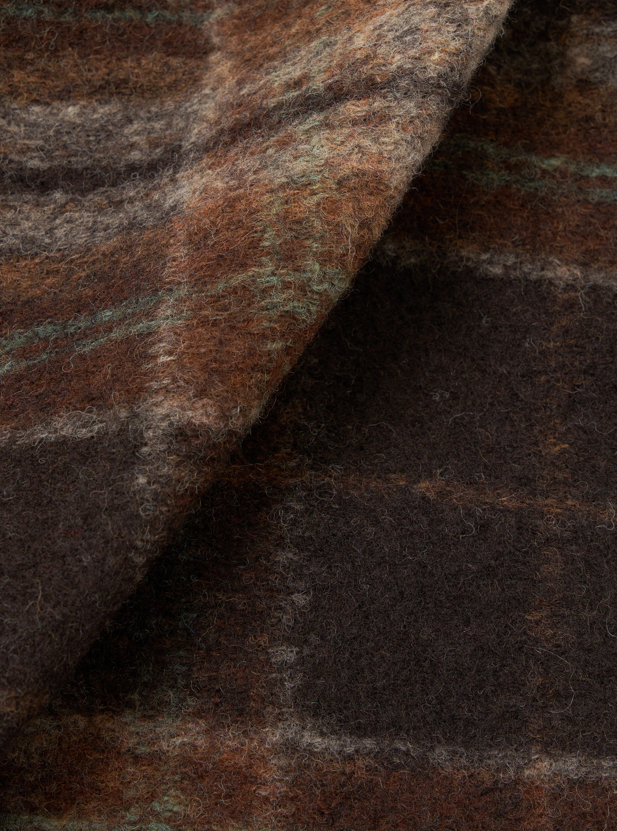 Detailed fabric swatch image showing the rich texture and soft weave of the Brown Pino Wool Fleece Cardigan on a plain white background, displaying the recycled wool and polyester fleece material.