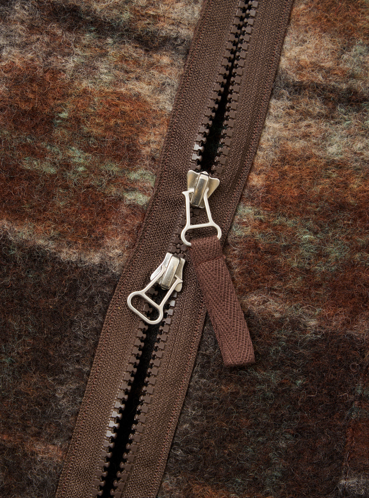 Close-up shot of the Brown Pino Wool Fleece Military Liner Jacket set against a neutral background, highlighting the durable front zip closure, collar detail, and tactile fleece fabric texture.