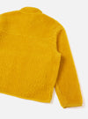 A back view of a model wearing the Yellow Artic Fleece Hep Mountain Jacket in a studio setting with a neutral background. The shot highlights the fit across the back, fleece texture, and vibrant yellow colorway.