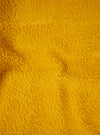 A detailed fabric swatch close-up of the Yellow Artic Fleece Hep Mountain Jacket against a plain white background, showing the plush pile texture, fiber details, and vibrant yellow tone of the recycled fleece material.