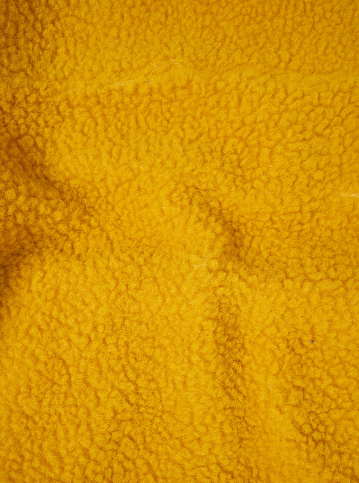 A detailed fabric swatch close-up of the Yellow Artic Fleece Hep Mountain Jacket against a plain white background, showing the plush pile texture, fiber details, and vibrant yellow tone of the recycled fleece material.