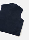 A back view of a model wearing the Navy Artic Fleece Hep Mountain Gilet against a plain studio background. The shot highlights the clean back panel construction, comfortable fit, and dark navy fleece texture.