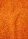 A fabric swatch close-up image of the Orange Artic Fleece Hep Mountain Gilet displayed on a white background, highlighting the intense orange color, fuzzy fleece pile, and wool-blend material texture.
