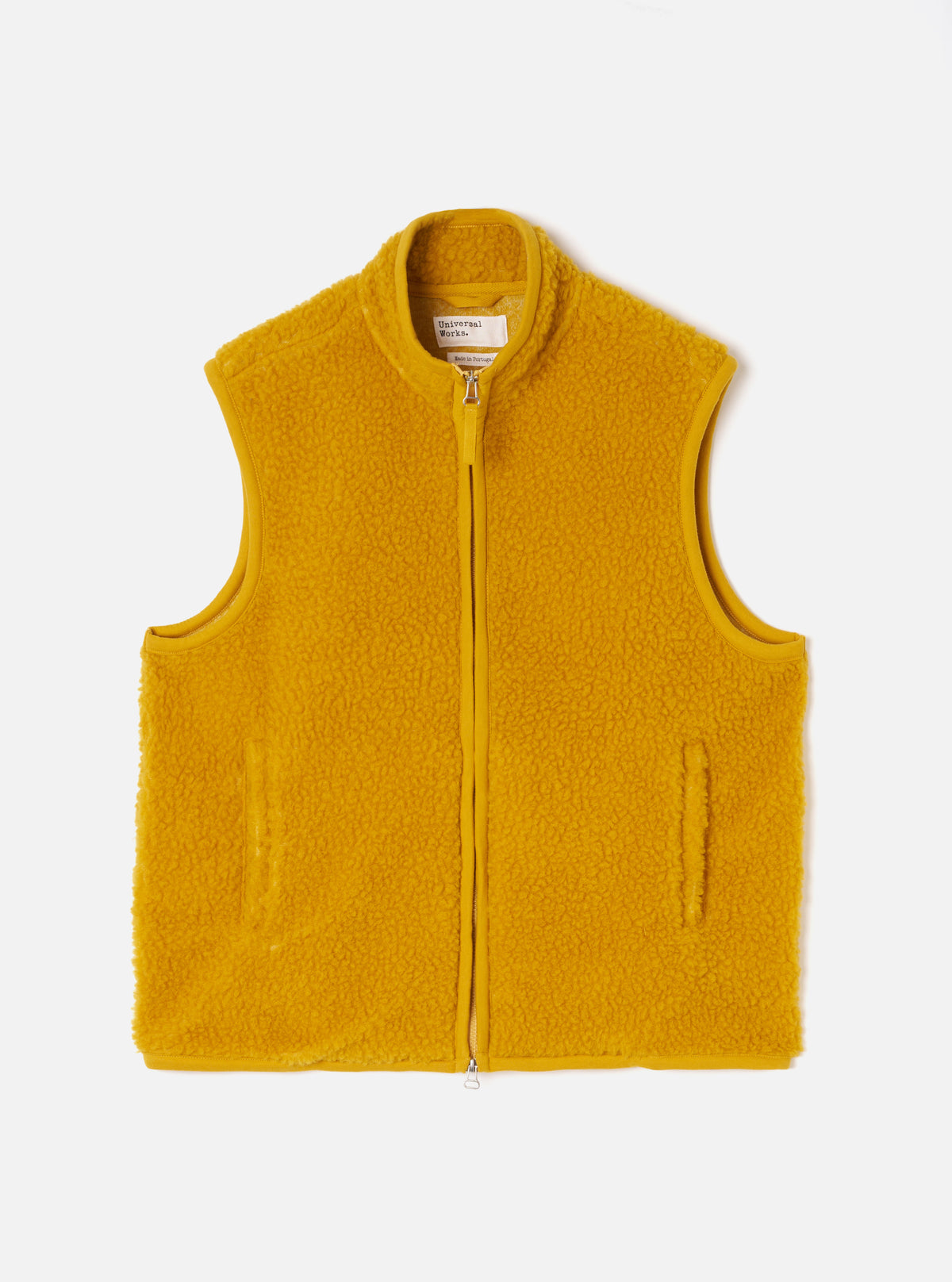 A full-length front view of a model wearing the Yellow Artic Fleece Hep Mountain Gilet in a plain studio setting. The image emphasizes the sleeveless silhouette, zip-front closure, and vibrant yellow fleece fabric.
