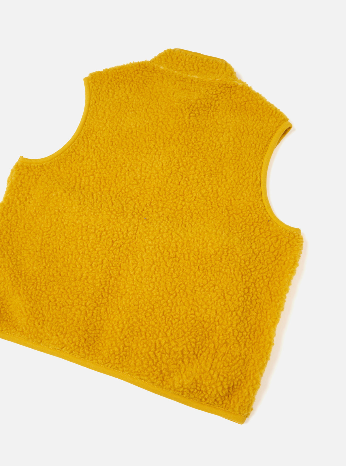 A back view of a model wearing the Yellow Artic Fleece Hep Mountain Gilet against a plain background, illustrating the clean back tailoring, comfortable fit, and bright yellow fleece texture.