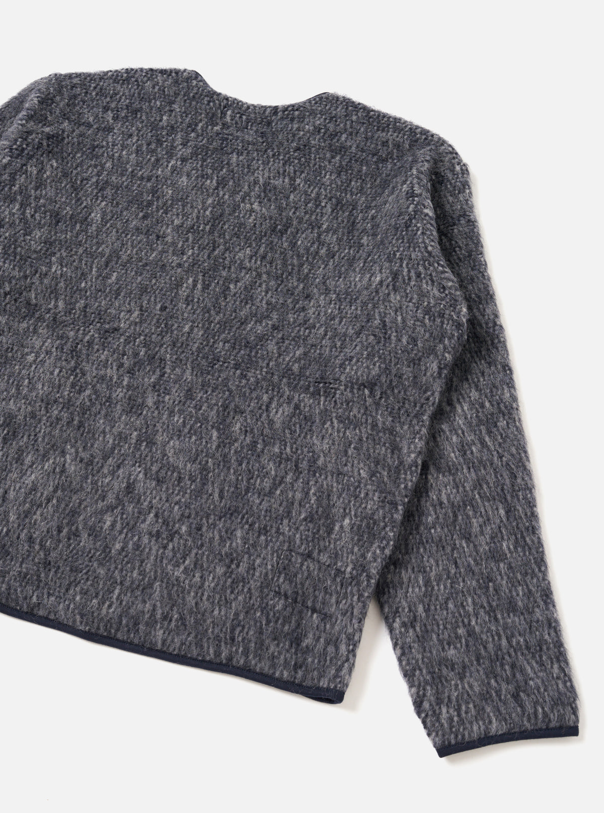 A back view of a model wearing the Navy/Pale Grey Losso Mohair Mix Zip Liner Jacket against a clean studio background, highlighting the relaxed fit, back seam detail, and mottled mohair texture.