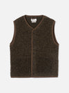 Brown boucle style fleece gilet laid flat on a light grey studio backdrop. V-neckline with brown binding trim running around the neck, armholes and hem. Six dark buttons fasten the centre front placket. Universal Works woven label visible at the neck. Textured, looped fleece fabric throughout.