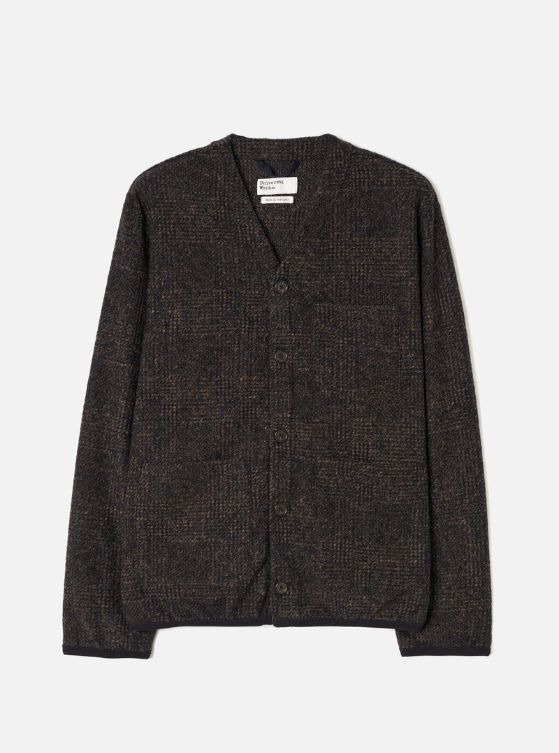 Full front product view of the Navy Deca Light Knit Cardigan displayed on a plain white background. The image showcases the V-neckline, button front fastening, ribbed cuffs, hem, and lightweight dark navy knit texture.