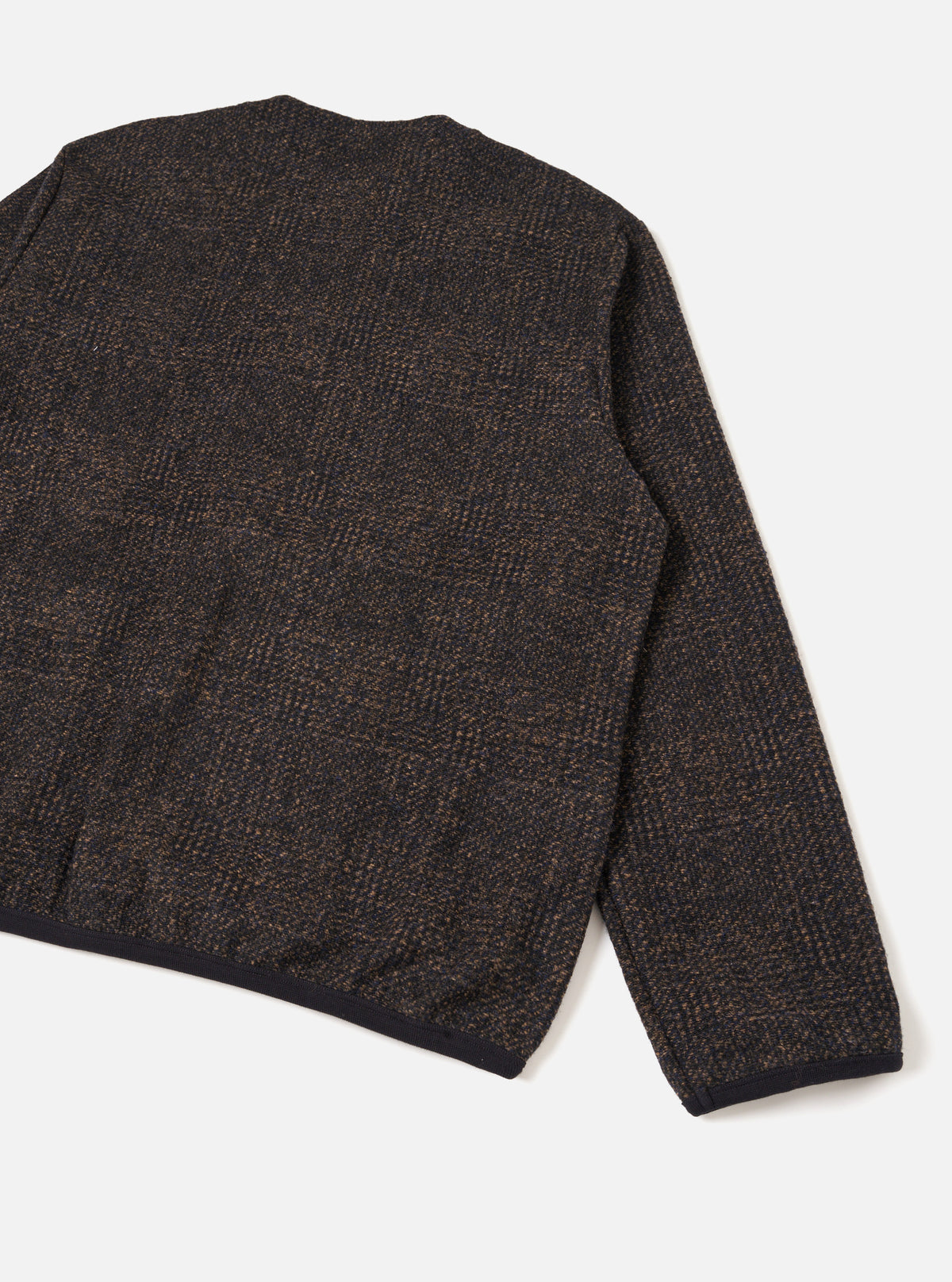 Full back shot of the Navy Deca Light Knit Cardigan set against a seamless white studio background. The image displays the flat back construction, shoulder seams, and smooth fine-knit finish of the dark navy cardigan.